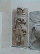 Giant holding a lion